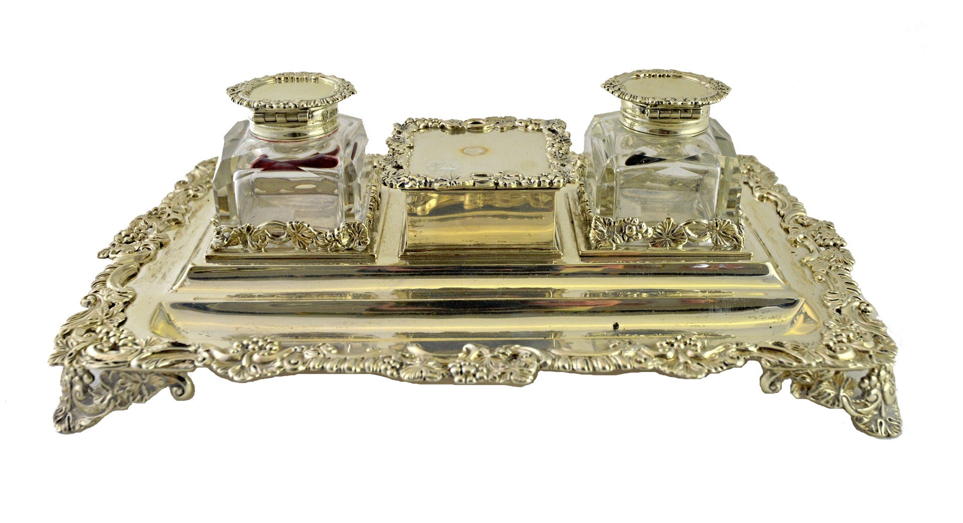 Appraisal: A silver inkstand of shaped rectangular form with cast foliate