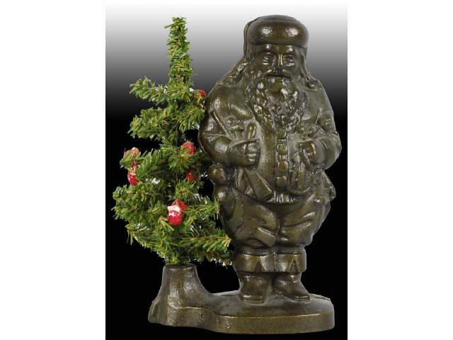 Appraisal: Cast Iron Santa with Wire Tree Still Bank Description Removable