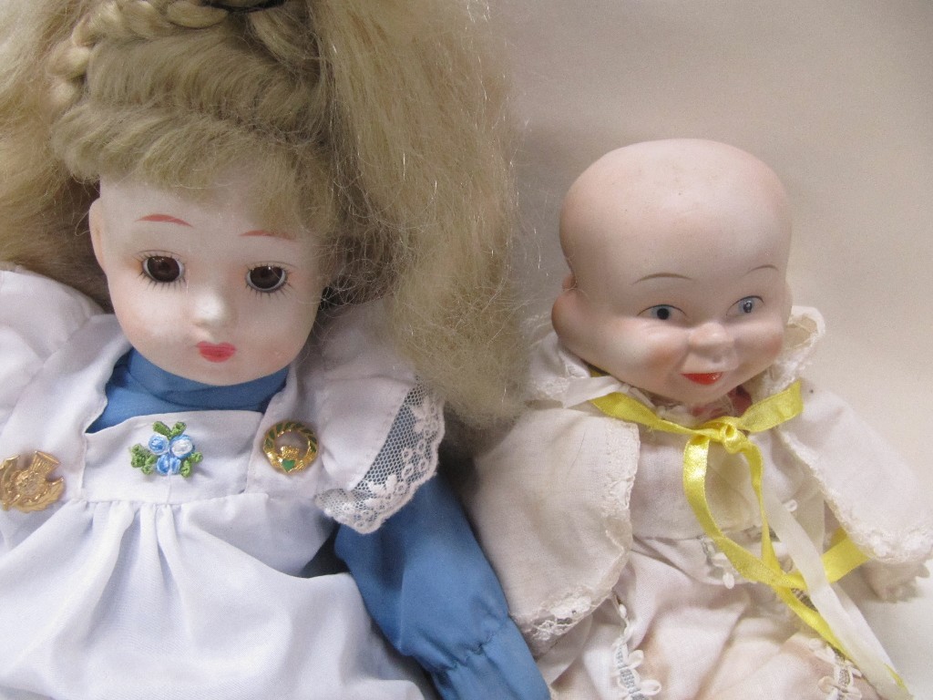 Appraisal: Lot comprising three faced doll and a girl doll