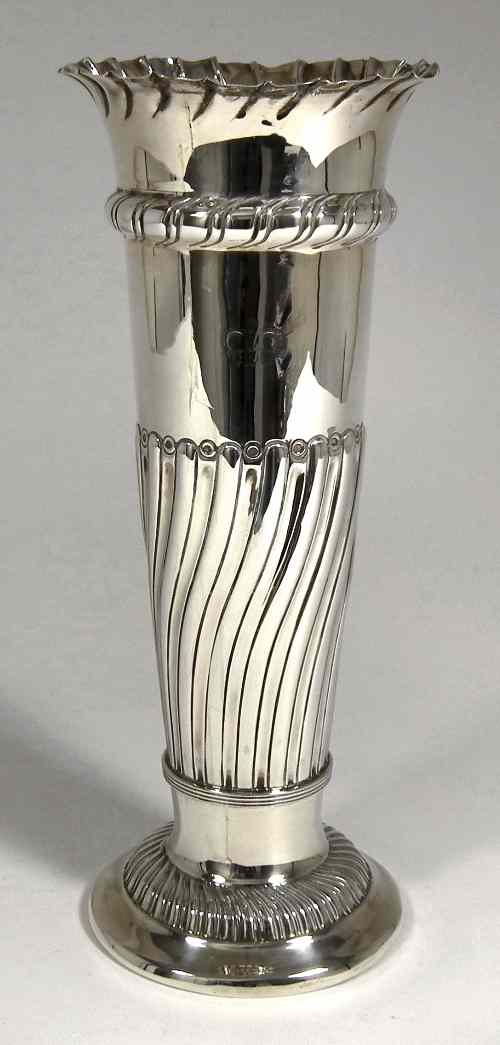 Appraisal: A late Victorian silver vase with crimped rim the body