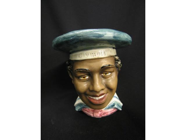 Appraisal: Black Americana Figural Pottery Tobacco Jar boy with cap Olympia