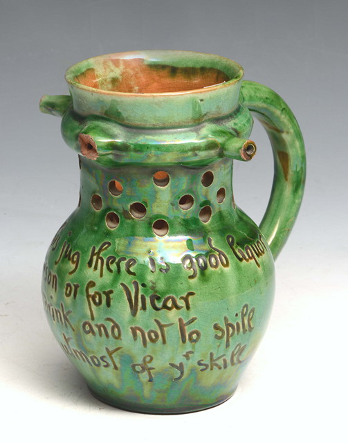 Appraisal: Edwin Beer Fishley British - Puzzle jug Fremington Pottery green