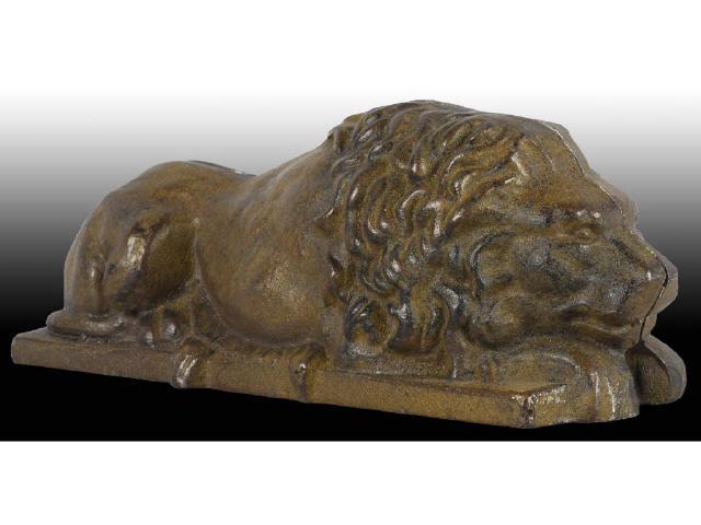 Appraisal: Cast Iron Lying Down Lion Still Bank Description Missing screw