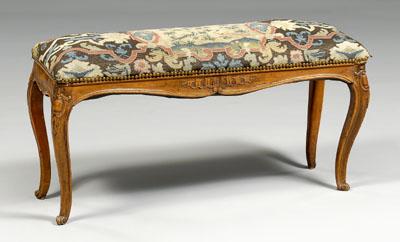 Appraisal: French Provincial upholstered bench carved fruitwood skirt and legs with