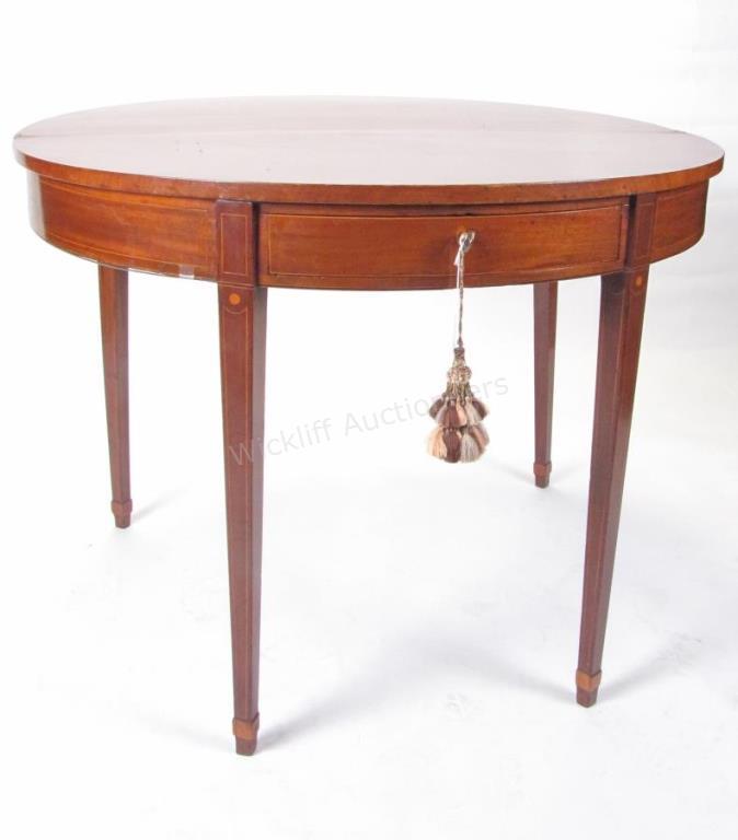 Appraisal: A vintage demilune mahogany game table flip top with gate