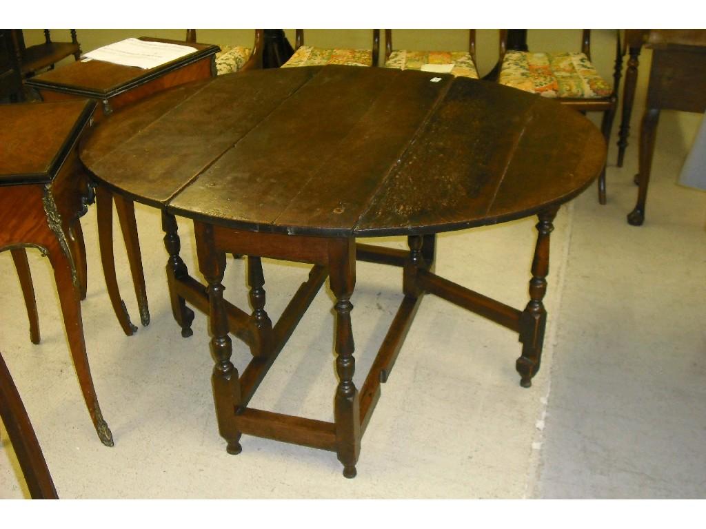 Appraisal: th century country oak gateleg table the oval panel top