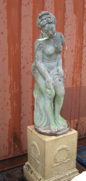 Appraisal: A reconstituted stone figure of a scantily clad maiden raised