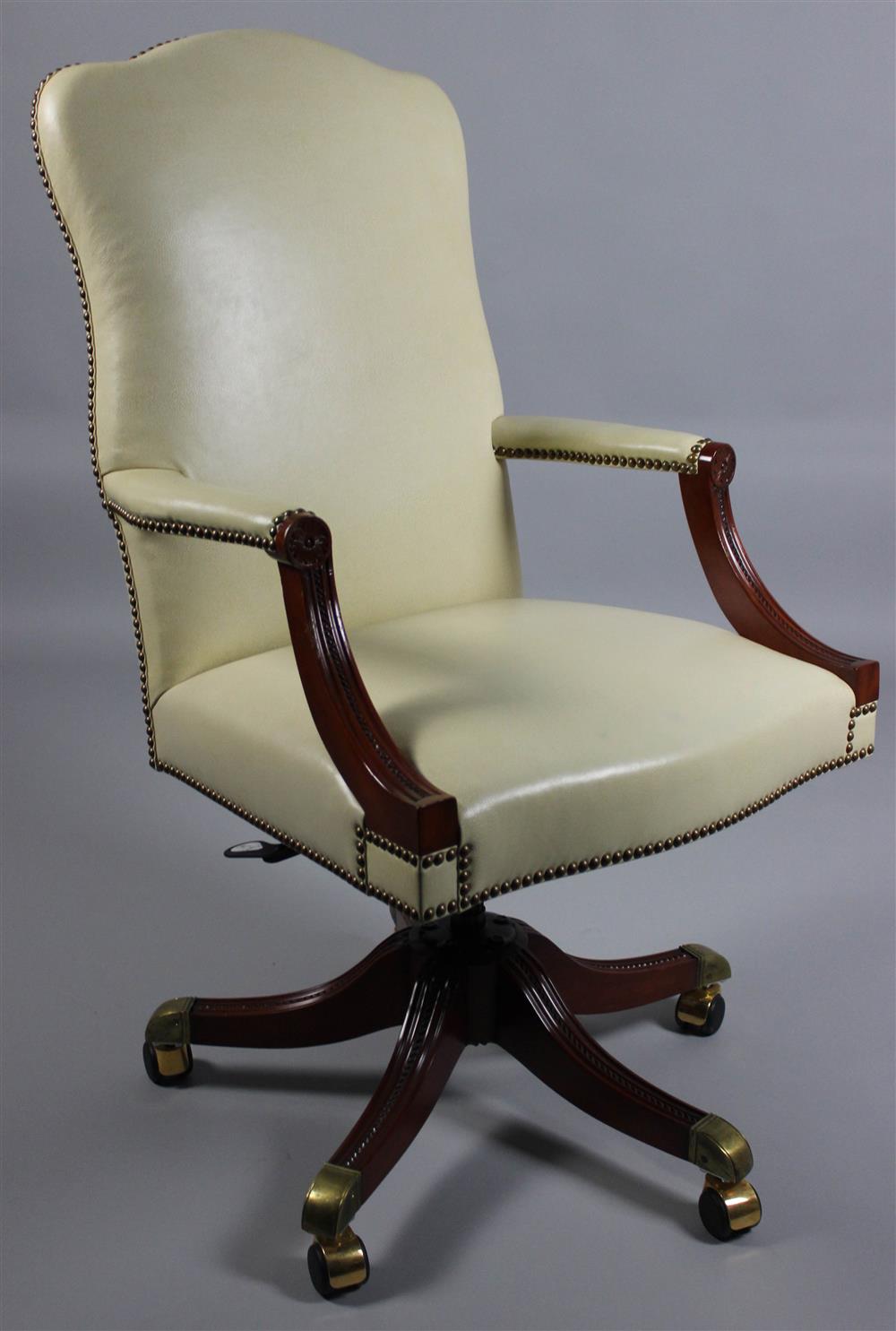 Appraisal: TRADITIONAL PEBBLE LEATHER DESK ARM CHAIR ON WHEELED BASE shaped