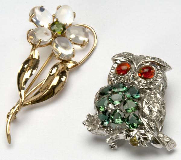 Appraisal: TWO GOLD AND GEMSTONE BROOCHES k wg owl with diamond