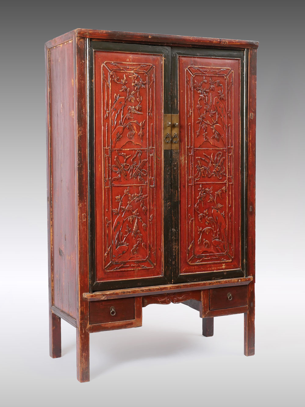 Appraisal: CHINESE RED LACQUERED SHANXI CABINET Red black lacquered Chinese Shanxi