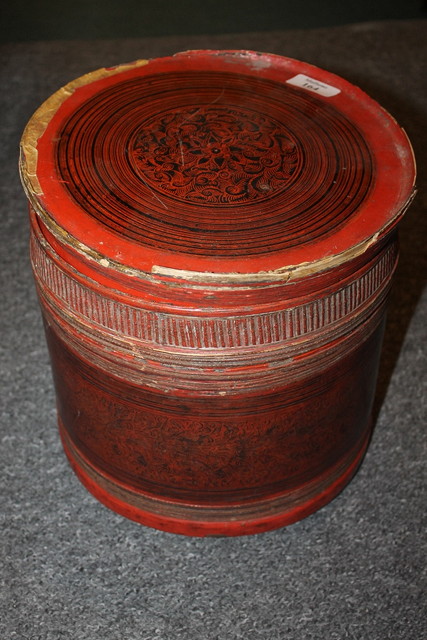 Appraisal: A BURMESE RED LACQUER MARRIAGE BOX with foliate decoration to