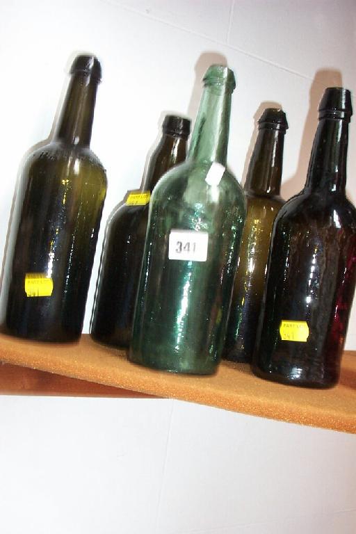 Appraisal: A collection of th century green glass bottles of various