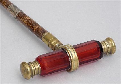 Appraisal: BAMBOO CANE WITH RUBY GLASS SCENT BOTTLE HANDLE The -sided