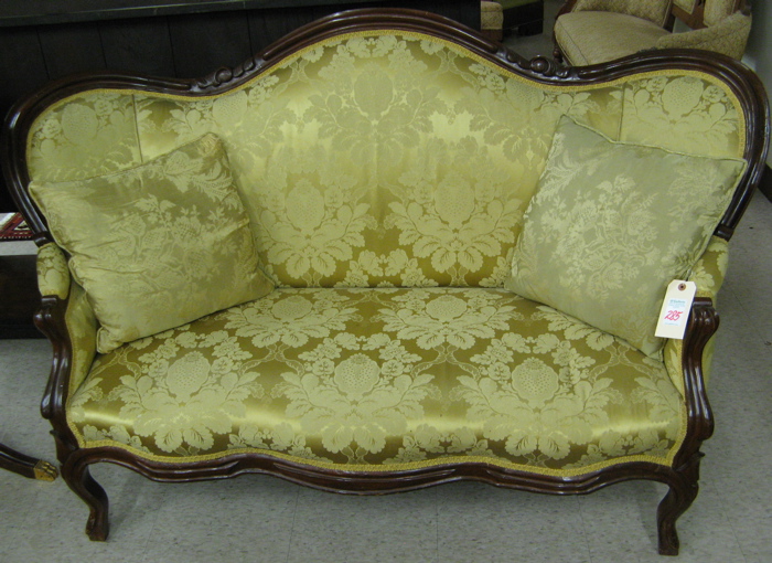 Appraisal: A VICTORIAN SERPENTINE-BACK SOFA Rococo Revival design American c having