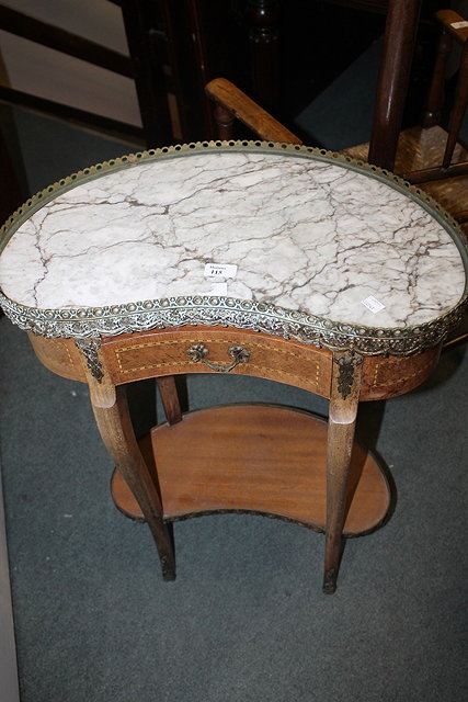 Appraisal: A FRENCH WALNUT KIDNEY SHAPED SIDE TABLE on cabriole supports