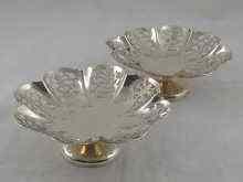 Appraisal: A pair of silver pierced lobed footed bon bon dishes