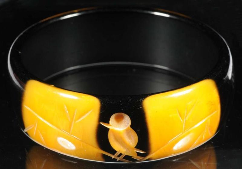 Appraisal: Bakelite Yellow Black Bracelet Description Includes bird inlay and flower