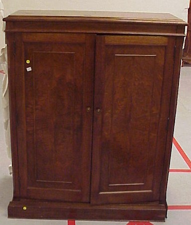 Appraisal: Standing cabinet mahogany with walnut veneers two door cabinet with