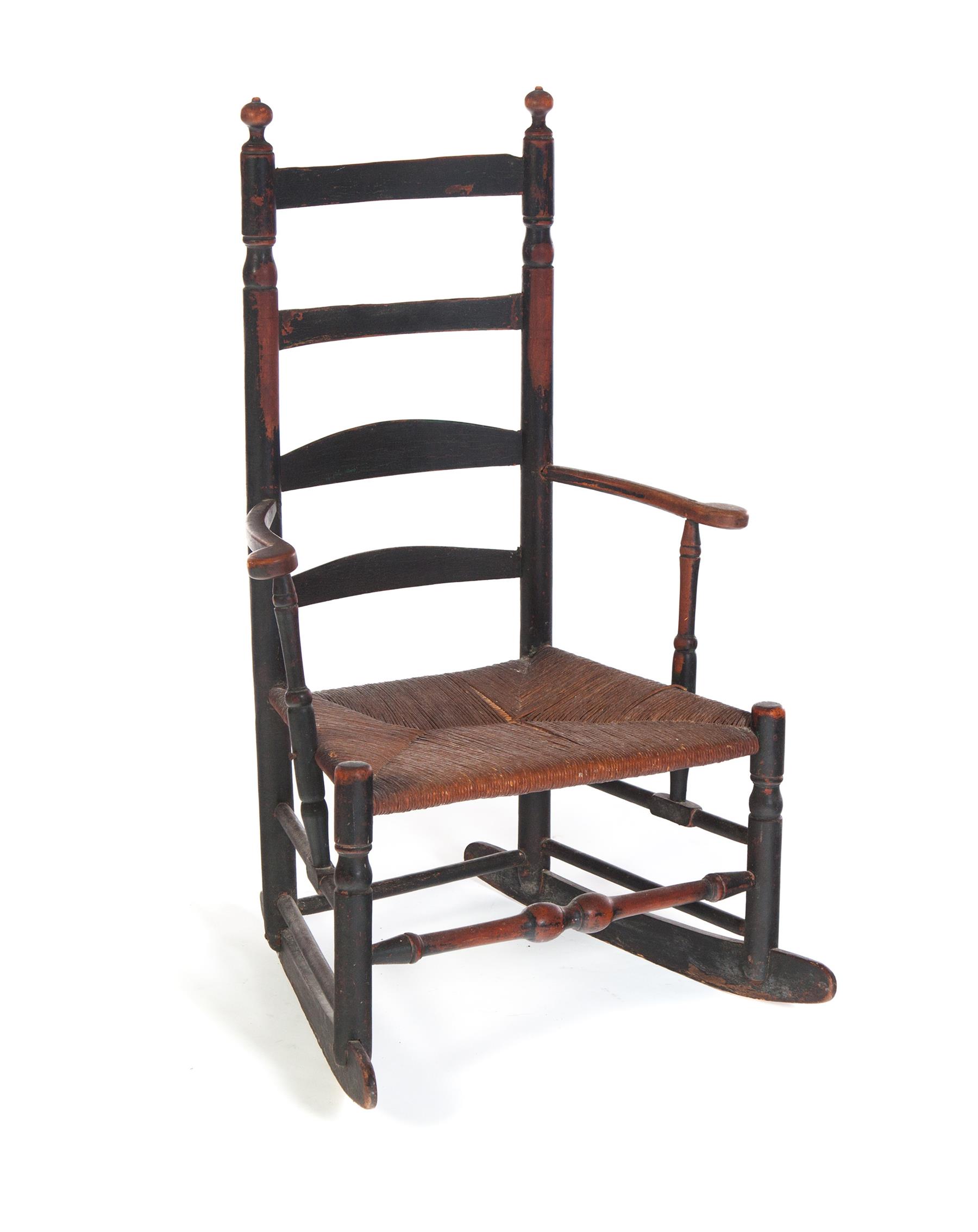 Appraisal: AMERICAN LADDERBACK ROCKER Nineteenth century mixed woods Scrolled arms and