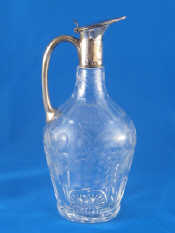 Appraisal: A late Victorian silver mounted claret jug panel cut and