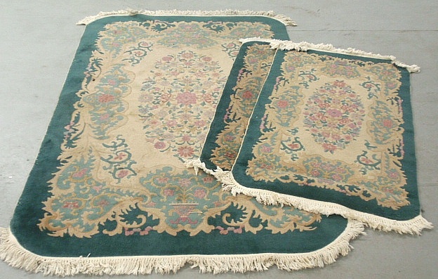 Appraisal: - Three green Chinese carpets largest x smaller two x