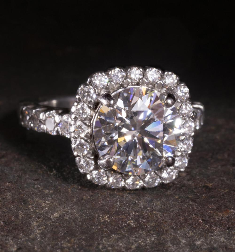 Appraisal: ESTATE RITANI SIGNED DIAMOND AND PLATINUM RING WITH APPRAISAL GRADING