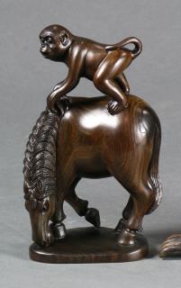 Appraisal: Japanese Wooden Monkey on a Horse Japanese wood carving of