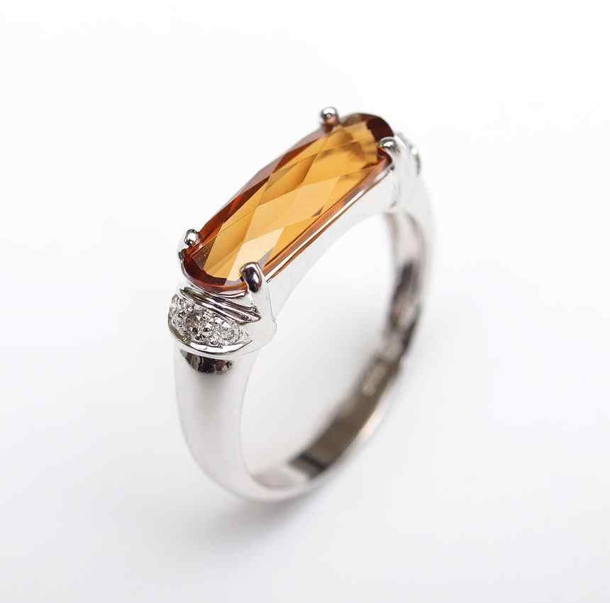 Appraisal: K CITRINE DIAMOND RING K white gold ring contains one