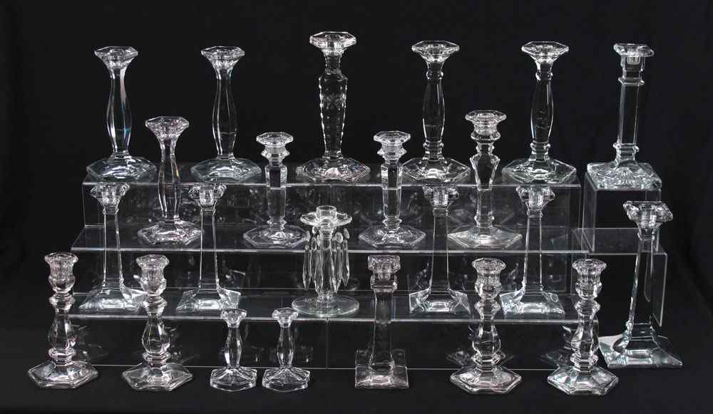 Appraisal: HEISEY GLASS CANDLE STICKS All clear glass the smallest ''