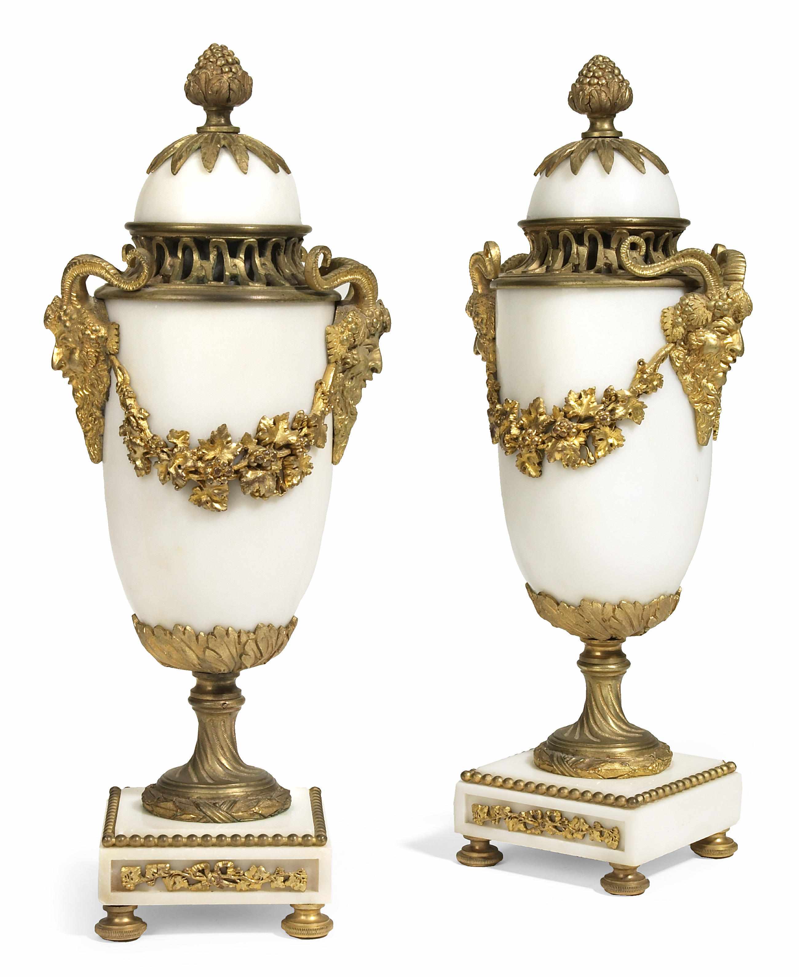 Appraisal: A pair of Louis XVI style gilt bronze mounted white