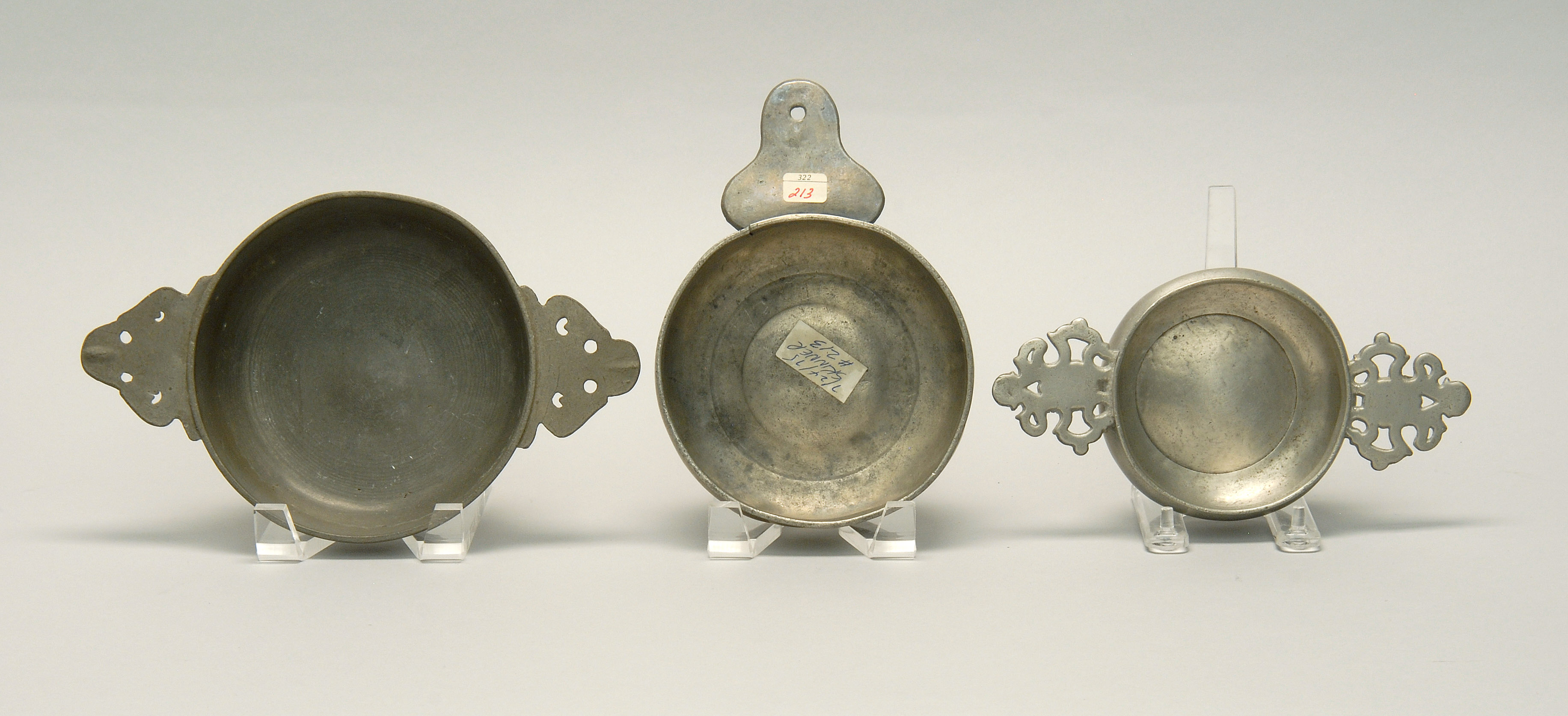 Appraisal: THREE ANTIQUE EUROPEAN PEWTER PORRINGERS th CenturyTwo with double handles