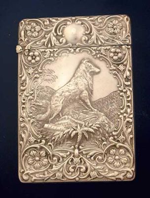 Appraisal: An Edwardian card case stamped in relief with a collie