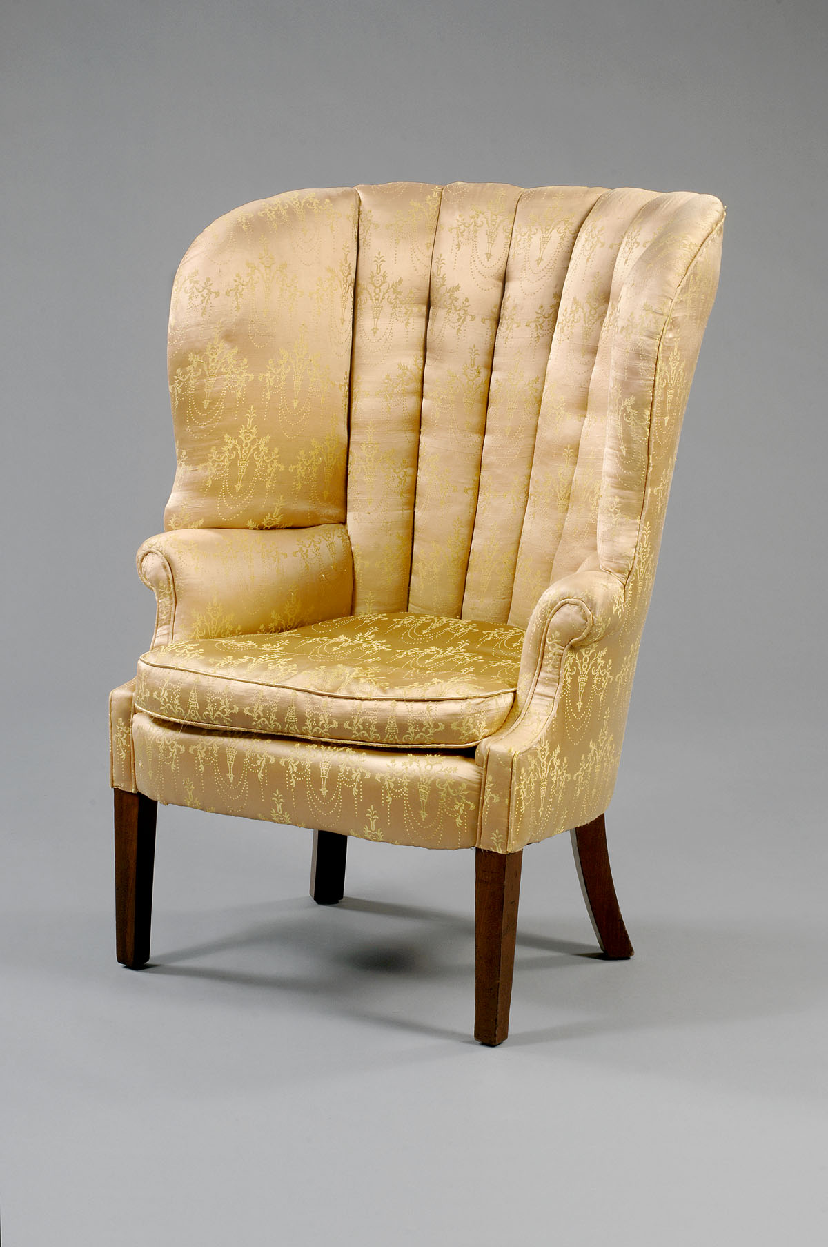 Appraisal: PHILADELPHIA HEPPLEWHITE MAHOGANY BARREL-BACK WINGCHAIR The curved barrel-back with channeled