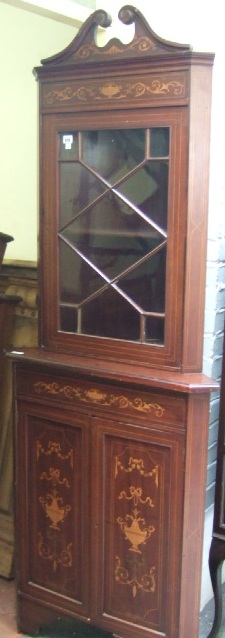 Appraisal: A th century marquetry inlaid mahogany floor standing corner cabinet