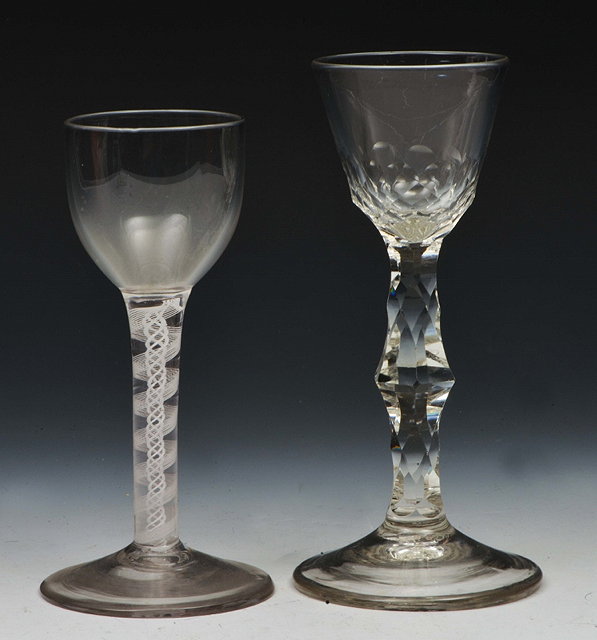 Appraisal: A WINE GLASS with facet cut bowl and baluster stem