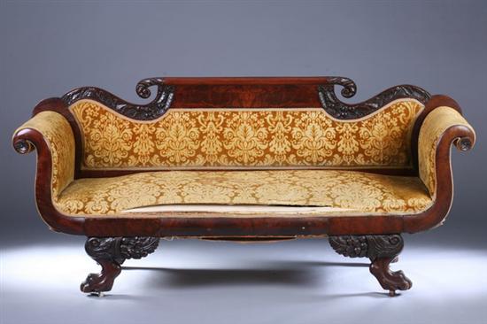 Appraisal: LATE FEDERAL CARVED MAHOGANY SLEIGH-FORM SOFA early th century with