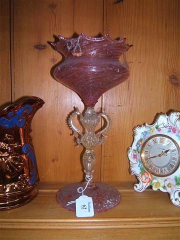 Appraisal: A Venetian pink and gold glass goblet of swirling design