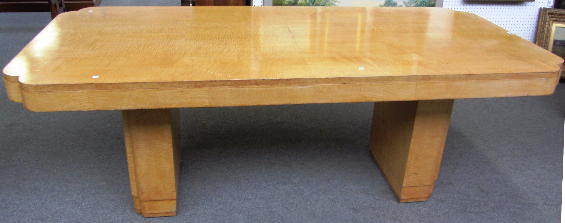 Appraisal: An Art Deco satin birch dining table the rectangular top