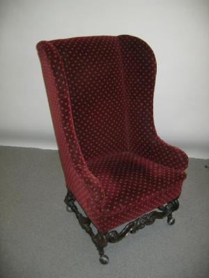 Appraisal: AN OAK FRAMED WING ARM CHAIR th century upholstered in