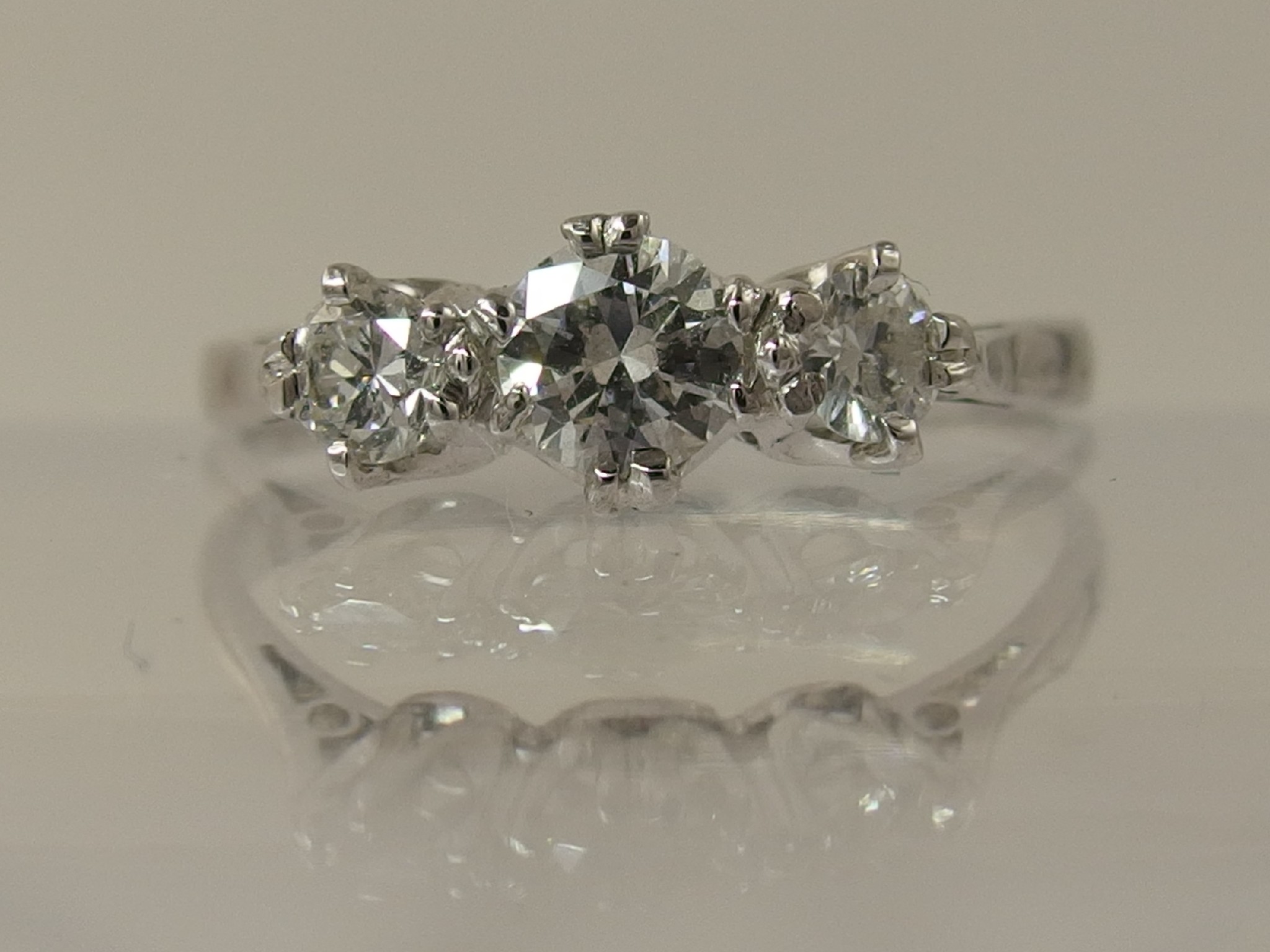 Appraisal: A platinum three stone diamond ringwith an approx diamond total