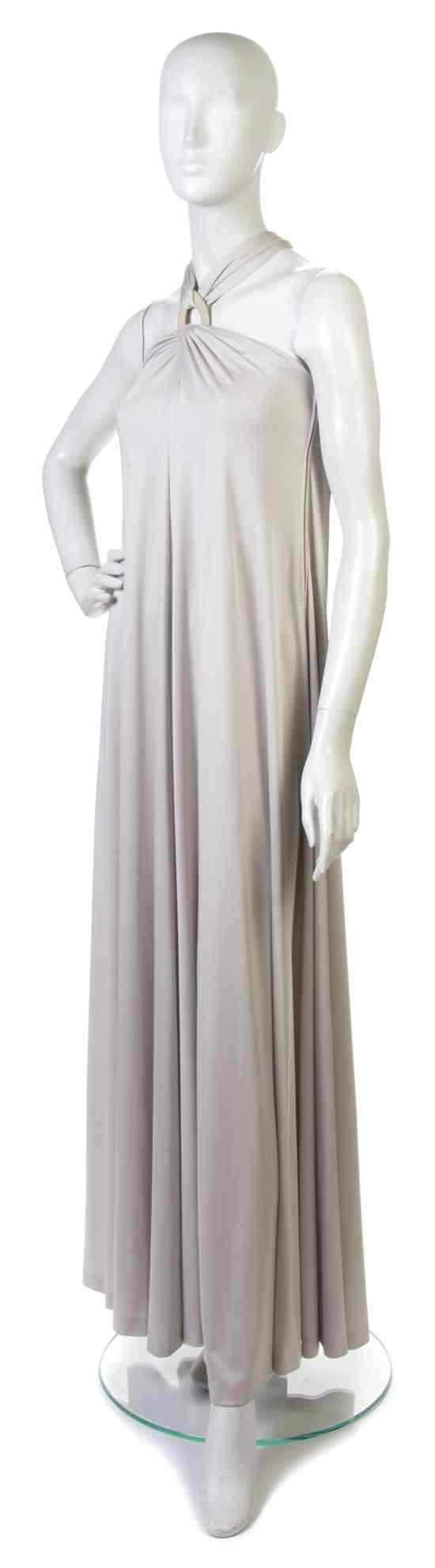 Appraisal: A Donald Brooks Taupe Jersey Evening Gown with halter neckline