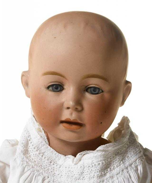 Appraisal: A SWAINE CO DOLL the bisque head with weighted blue