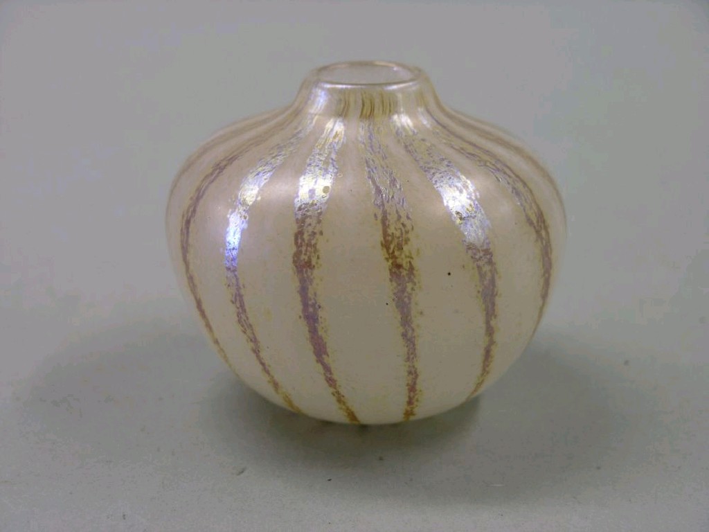 Appraisal: A Loetz-type irridescent glass posy vase with orange and white