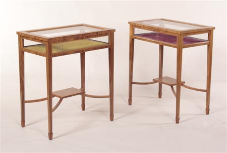 Appraisal: A pair of tulipwood and crossbanded bijouterie tables the hinged