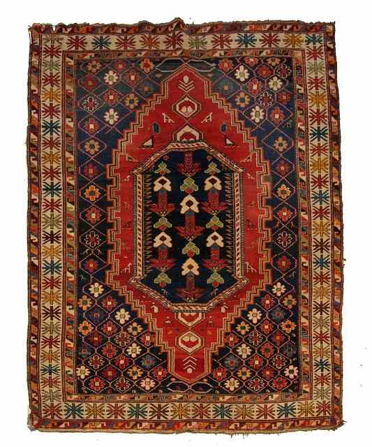 Appraisal: A SHIRVAN MULTICOLOURED RUG with a central foliate medallion within