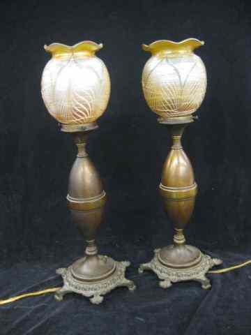 Appraisal: Pair of Quezal Art Glass Lamps feather threaded iridescent shades