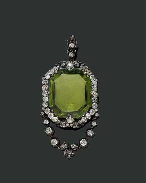 Appraisal: PERIDOT AND DIAMOND PENDANT ca Silver over ros gold Very