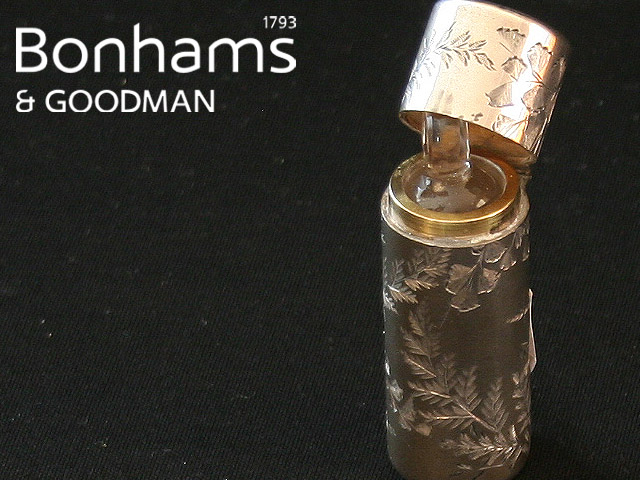 Appraisal: A Sterling silver cased scent bottle with engraved fern decoration