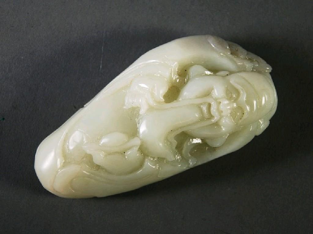 Appraisal: CHINESE CARVED JADE PEBBLE SHAPED PAPERWEIGHT ORNAMENT carved with the