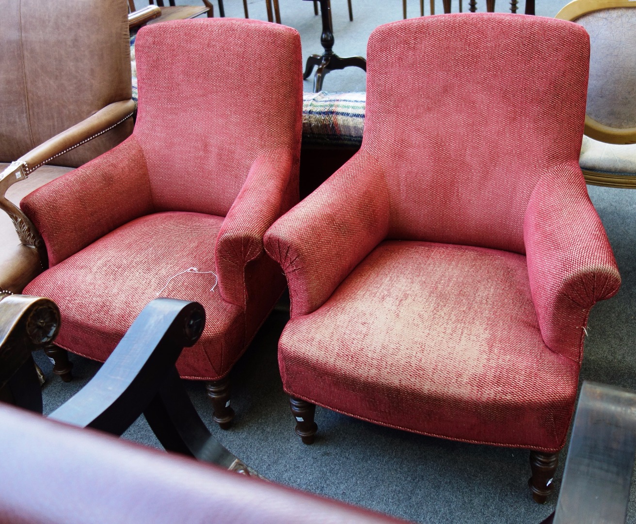 Appraisal: A pair of late Victorian easy armchairs on turned beech